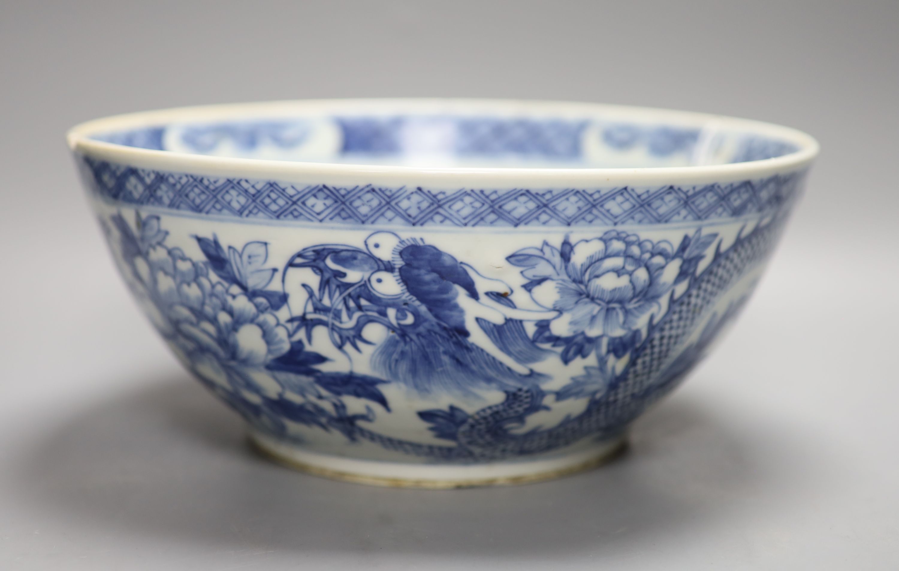 A 19th century Chinese porcelain blue and white dragon bowl, diameter 30cm